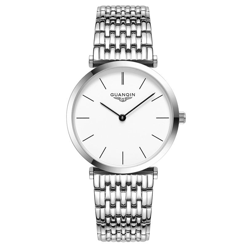 Silver watch with a white face on a white background