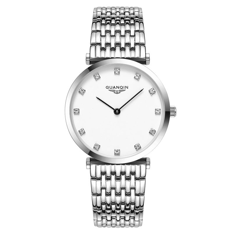 Silver watch with a white face and diamond-like stones on a white background