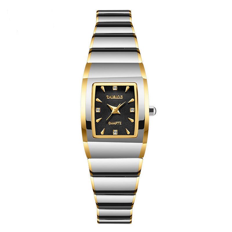 Two-tone watch with gold and silver band on a white background