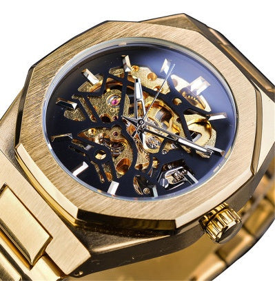Gold wristwatch with a detailed mechanical inner mechanism on a white background
