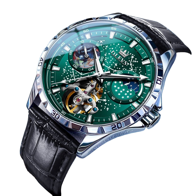 Luxury watch with green face and black leather strap on a blue background