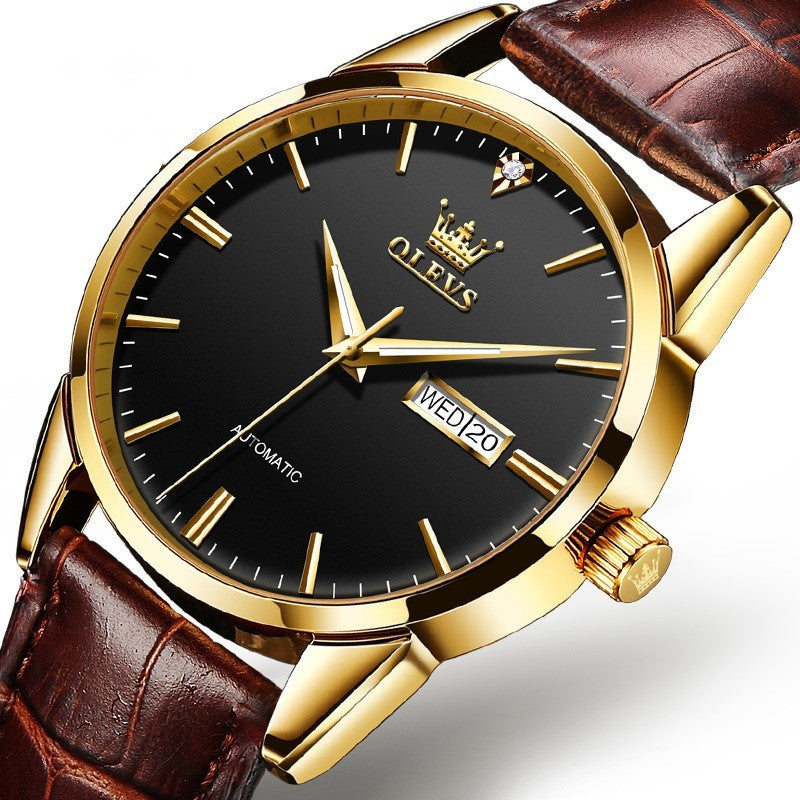 Gold-framed watch with black face and brown leather strap on a white background