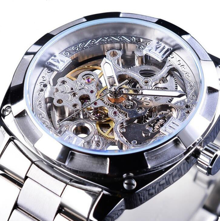 Close-up of a silver mechanical watch with intricate details