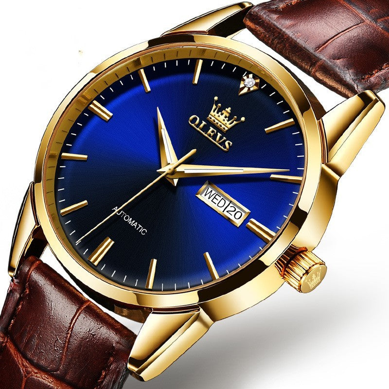 Luxury watch with blue face, gold case, and brown leather strap on a white background