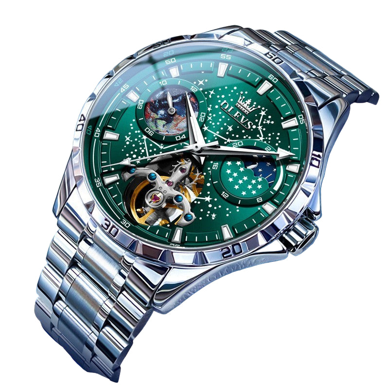 Luxury watch with green face and silver metal strap on a blue background