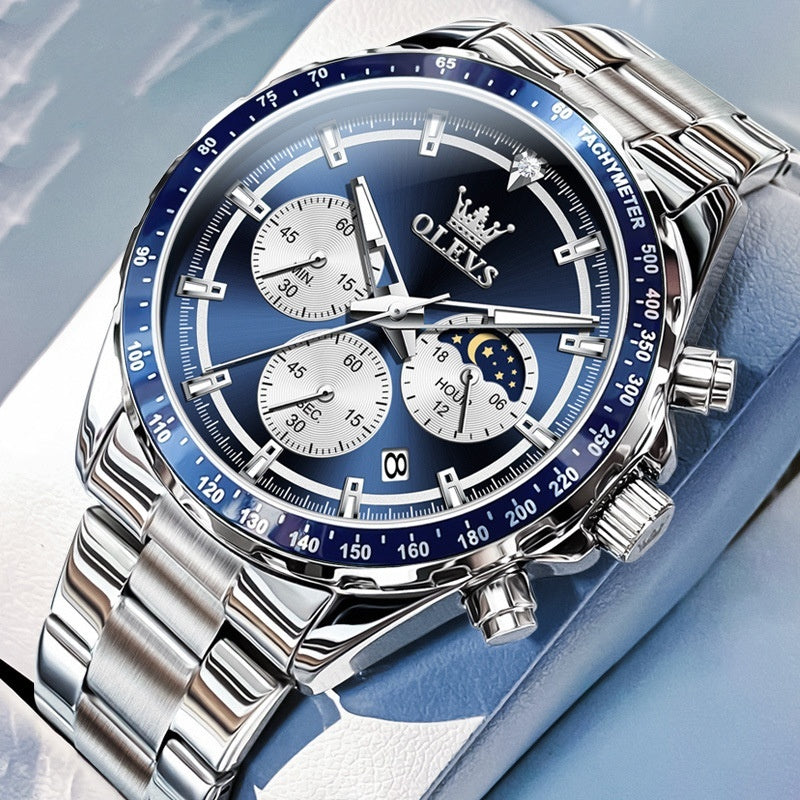 Silver watch with blue dial on a light gray background
