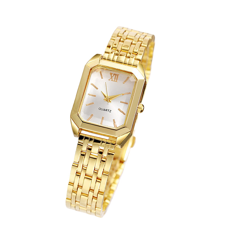 Gold wristwatch with a white face on a marble surface