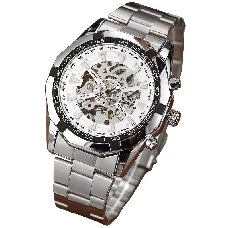 Silver wristwatch with a detailed face on a wooden surface