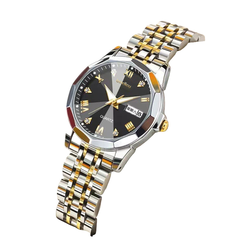 Luxury watch with a black face and gold accents on a white cushion