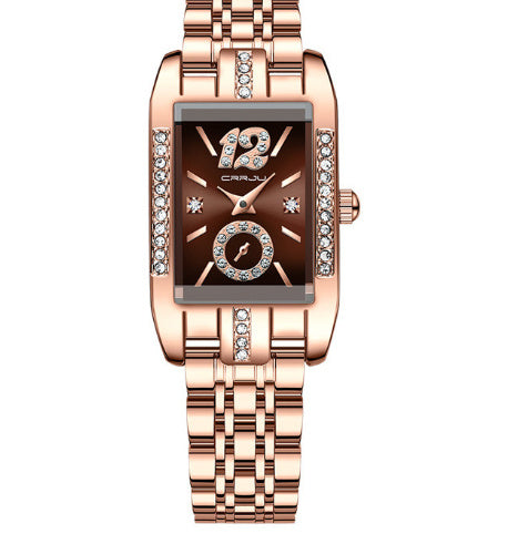 Rose gold watch with brown face on a white background