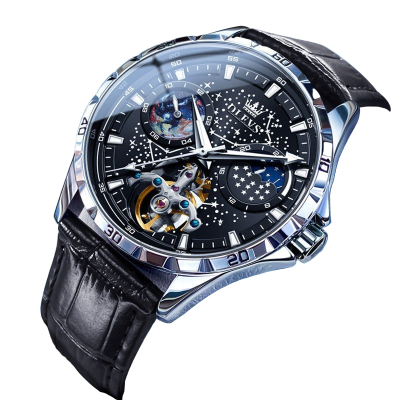Luxury watch with black leather strap and intricate design on a blue background