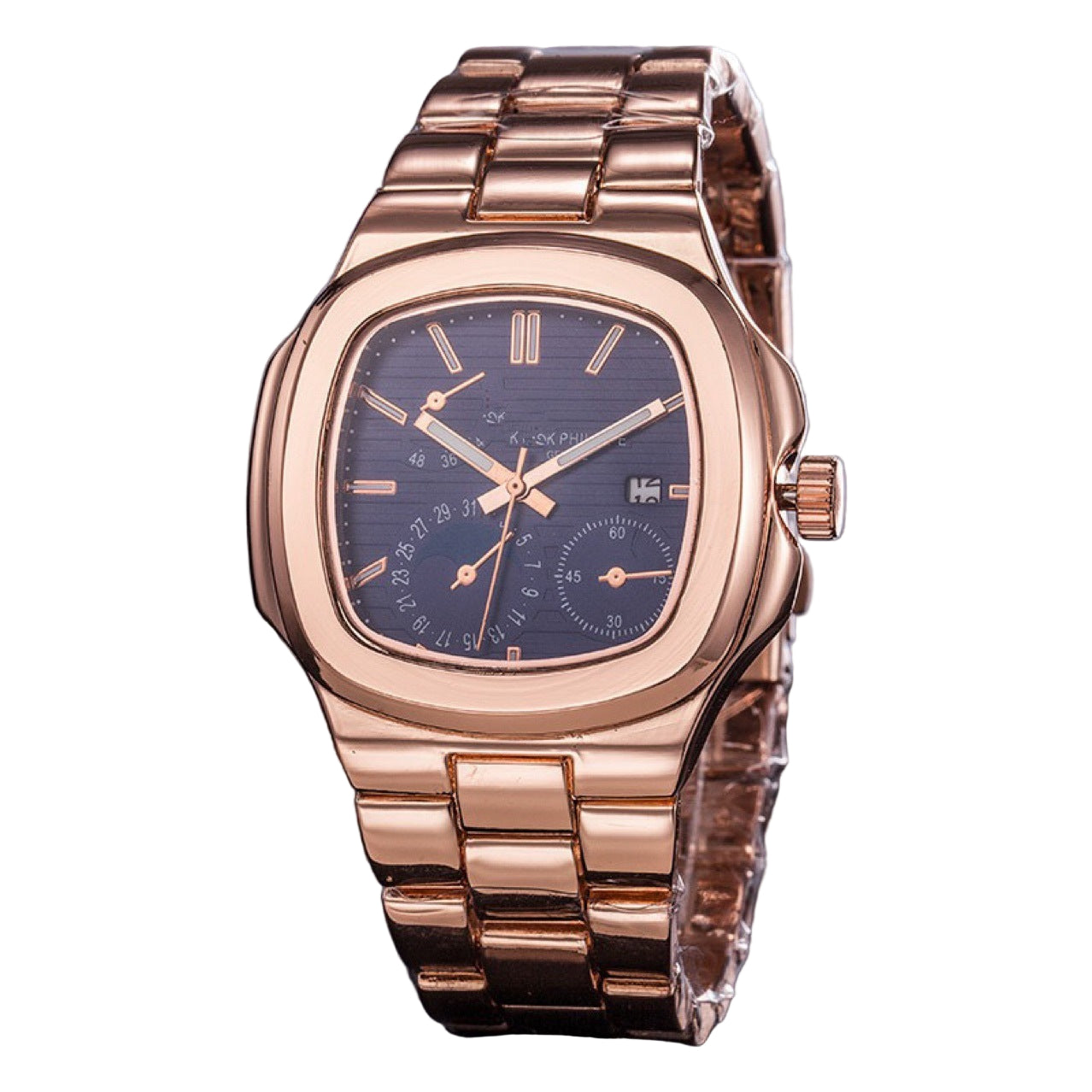 Rose gold watch with a blue face on a dark surface