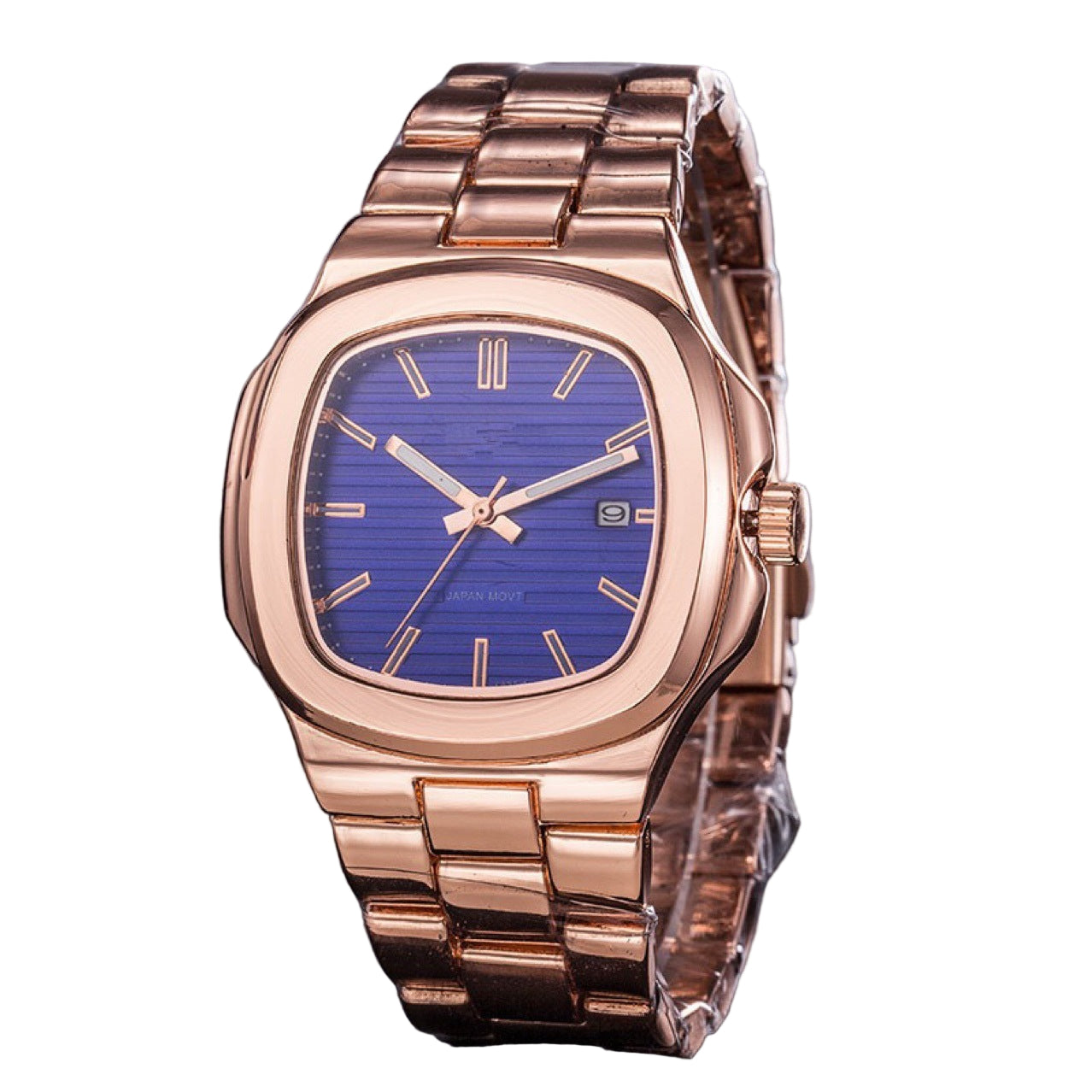 Rose gold watch with blue face on a dark surface