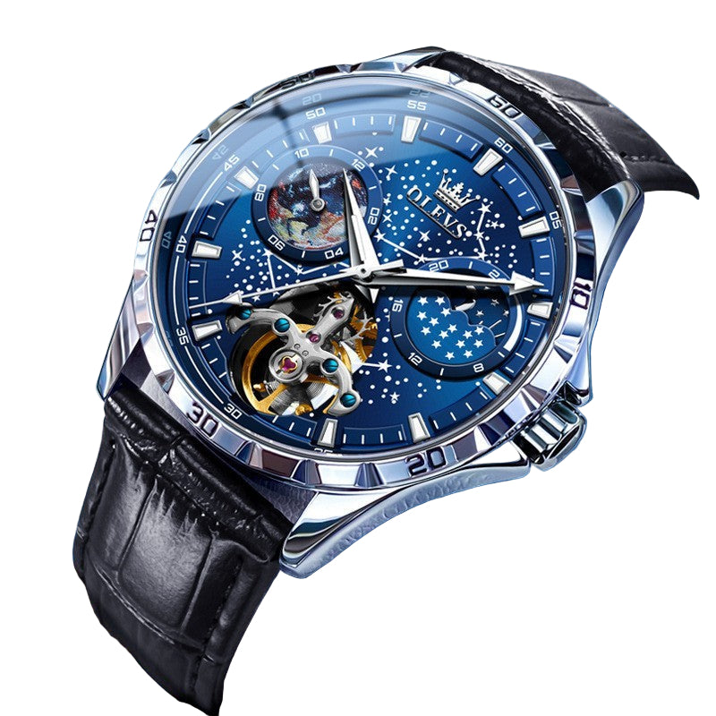 Luxury watch with blue face and black leather strap on a blue background