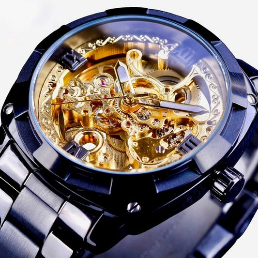 Luxury watch with gold mechanical components and black casing on a white background