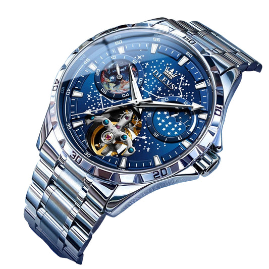 Luxury watch with blue face and silver metal strap on a blue background