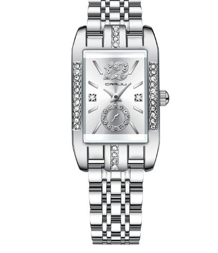 Silver wristwatch with decorative face on a white background