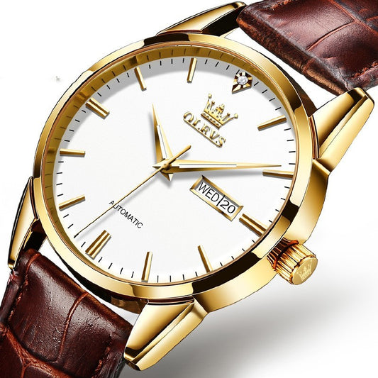 Gold watch with brown leather strap on a white background